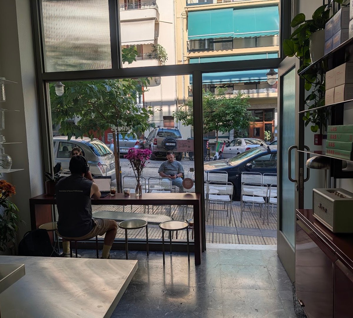 Interior of Kross Coffee Roasters Pagkrati, specialty coffee shop in Athens