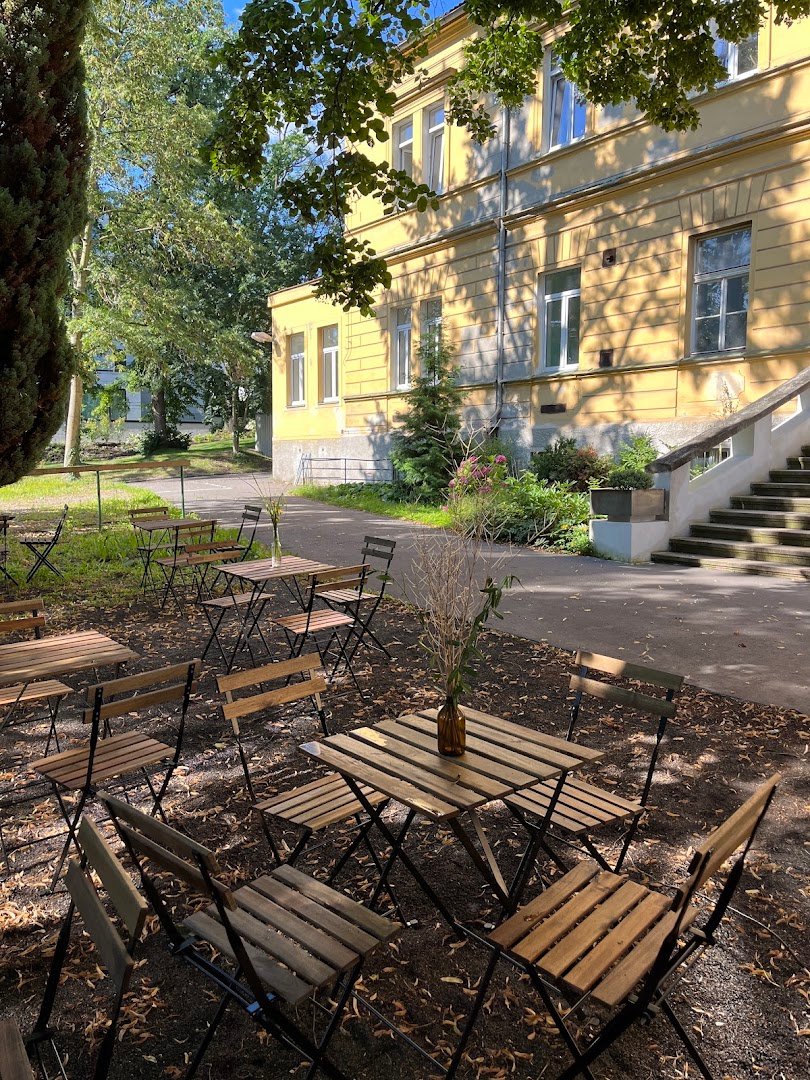 Storefront of Tusculum Coffee point, specialty coffee shop in Prague