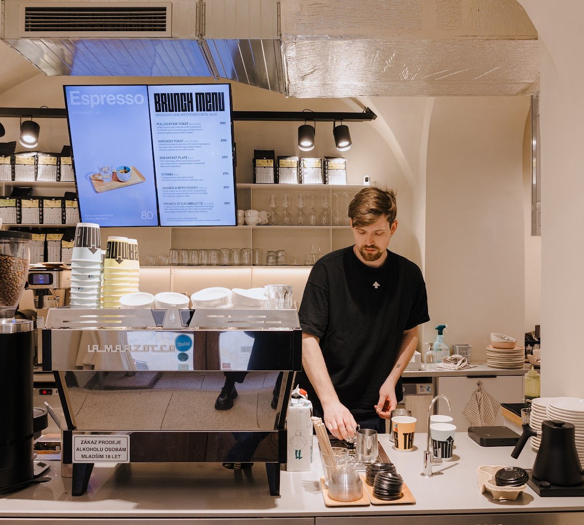 Interior of The Miners Coffee Charles Bridge, specialty coffee shop in Prague