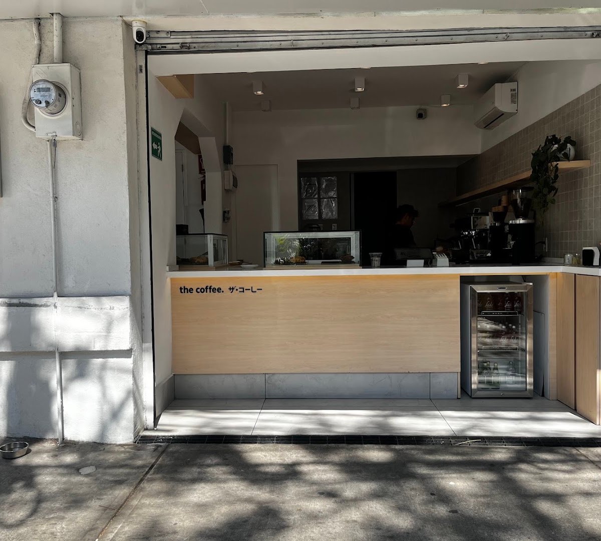 Storefront of The Coffee Roma Sur, specialty coffee shop in Mexico City
