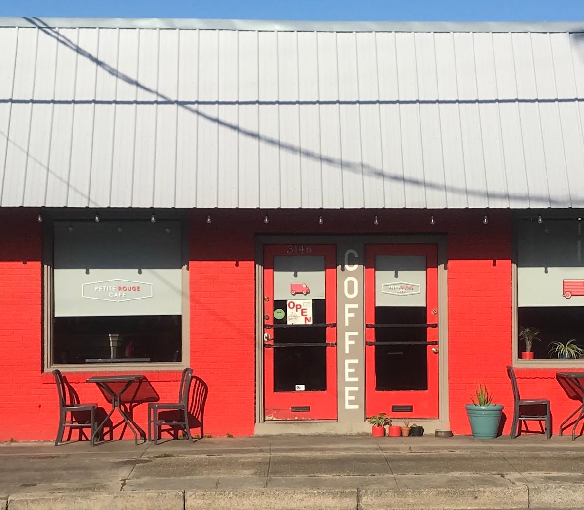 Storefront of Petite Rouge Cafe & Coffee Truck, specialty coffee shop in New Orleans