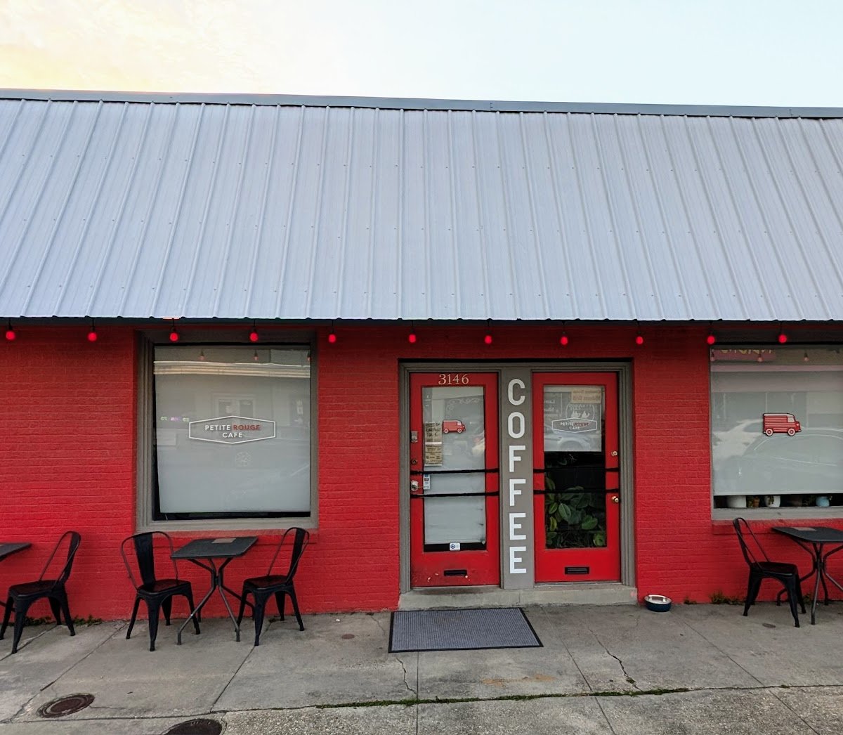 Storefront of Petite Rouge Cafe & Coffee Truck, specialty coffee shop in New Orleans