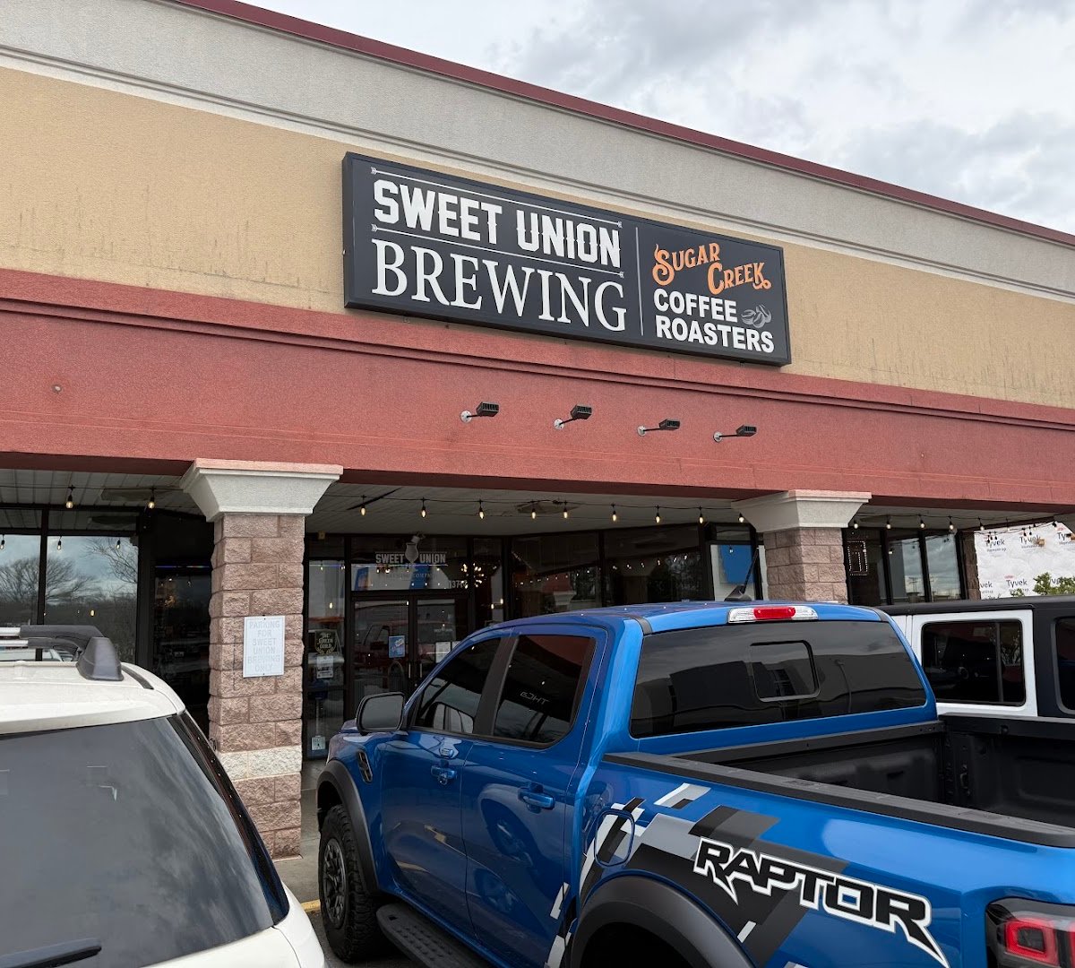 Storefront of Sugar Creek Coffee Roasters, specialty coffee shop in Charlotte