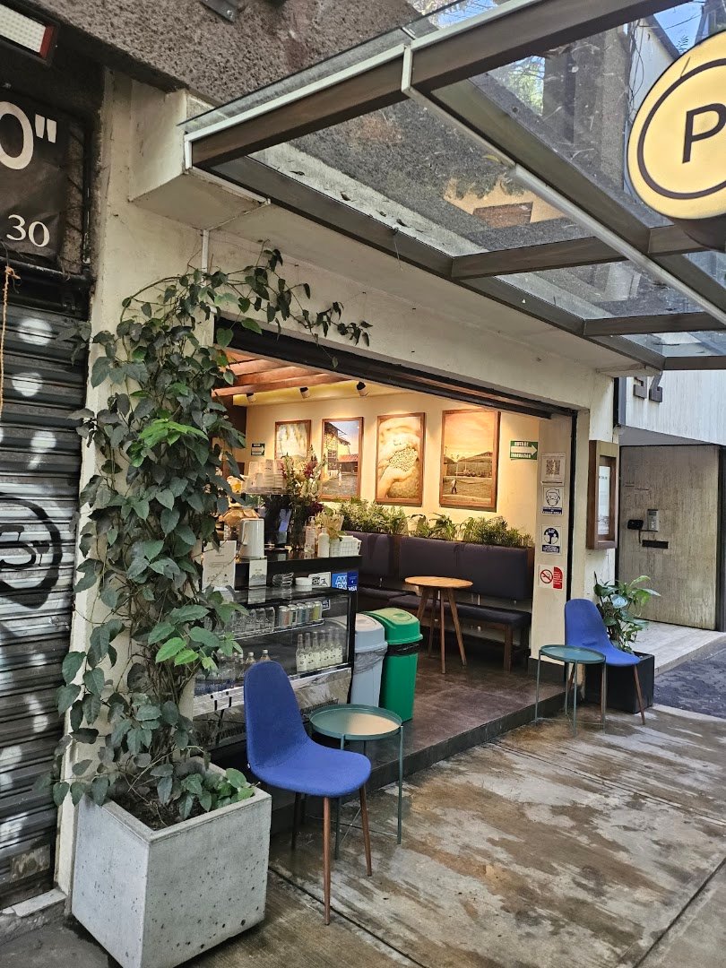 Storefront of Postales de Café, specialty coffee shop in Mexico City