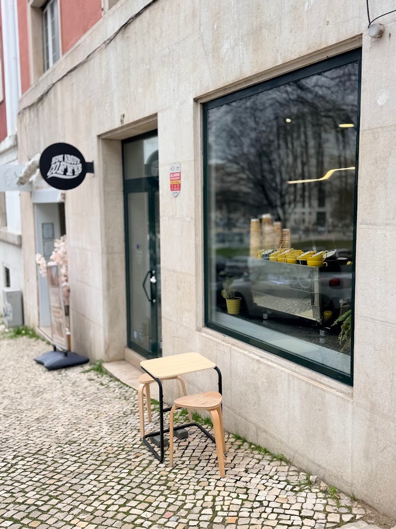 Storefront of How About Coffee | Speciality Coffee & Co-Working, specialty coffee shop in Lisbon