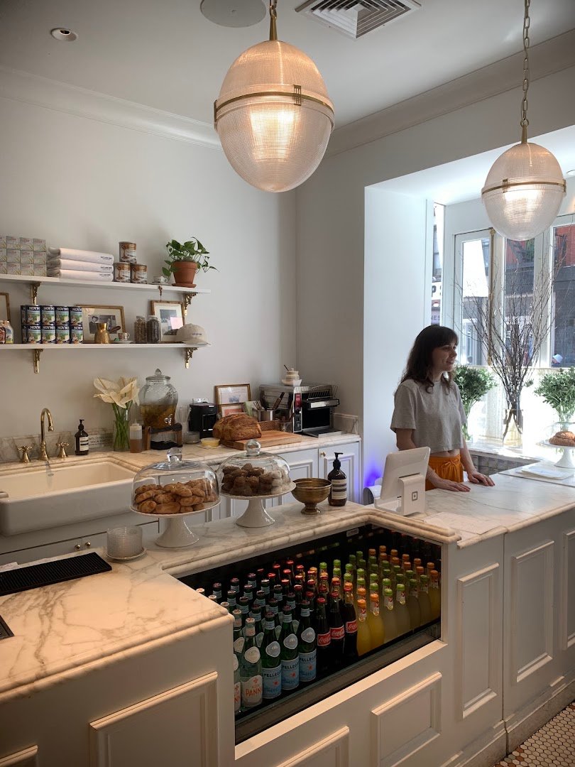 Interior of Café Leon Dore, specialty coffee shop in New York