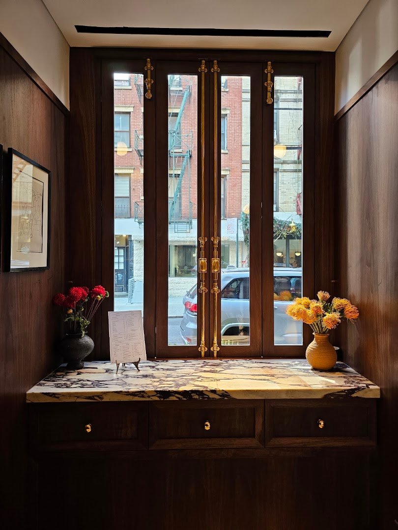 Interior of Café Leon Dore, specialty coffee shop in New York