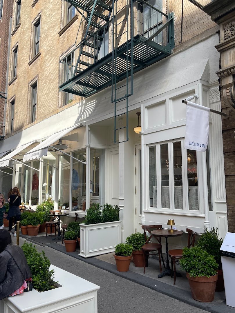 Storefront of Café Leon Dore, specialty coffee shop in New York