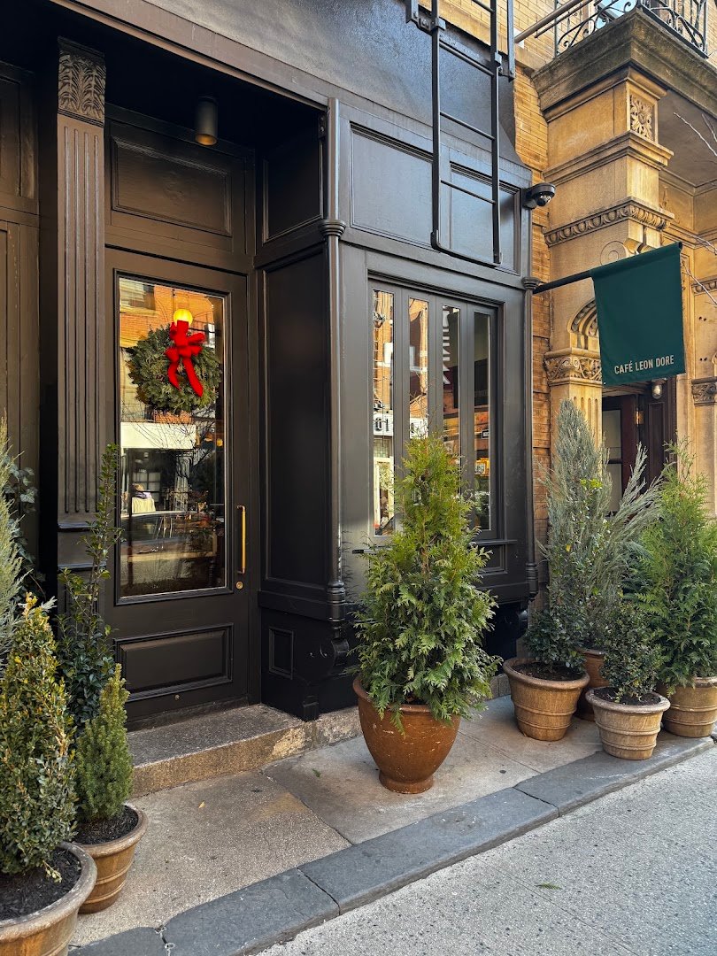 Storefront of Café Leon Dore, specialty coffee shop in New York