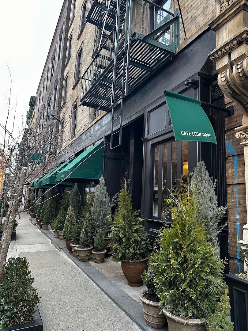 Storefront of Café Leon Dore, specialty coffee shop in New York