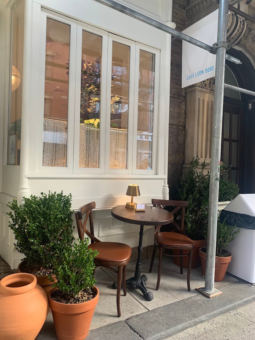 Storefront of Café Leon Dore, specialty coffee shop in New York