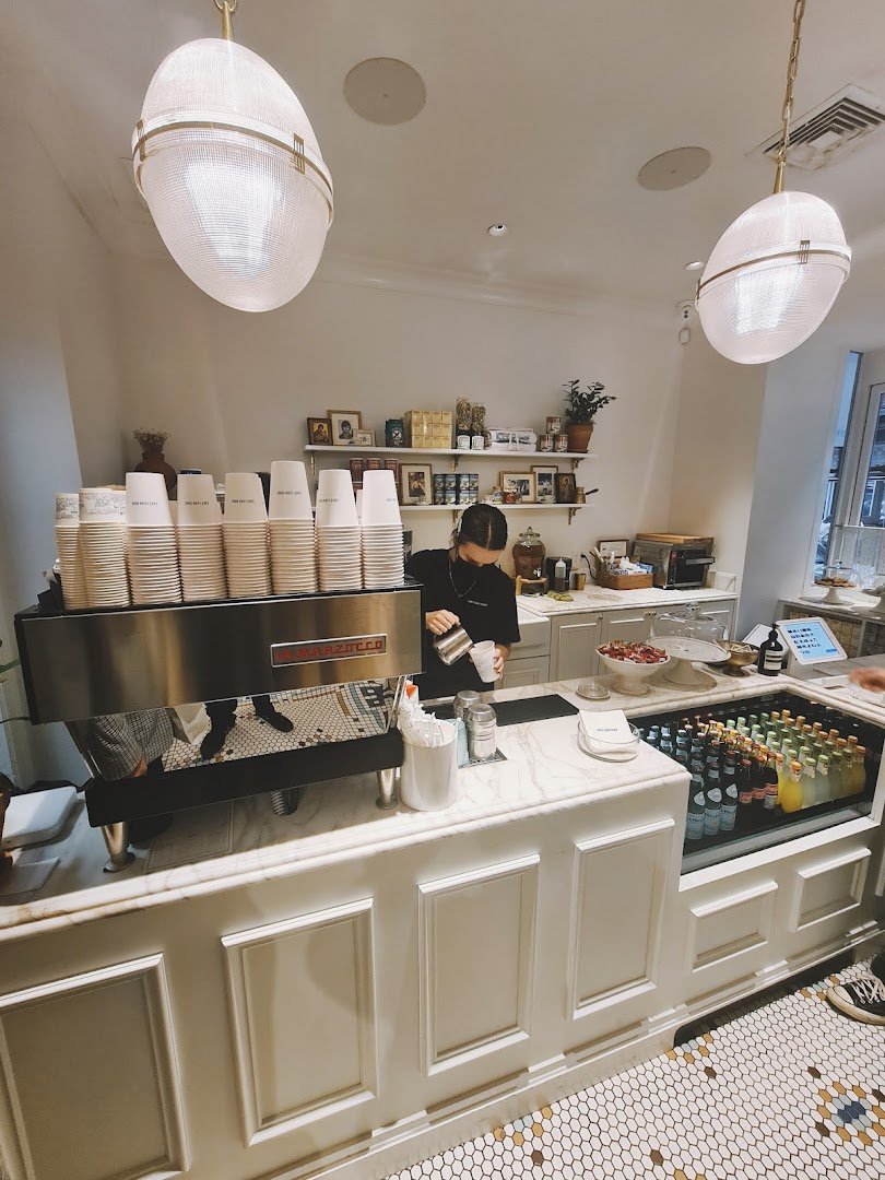 Interior of Café Leon Dore, specialty coffee shop in New York