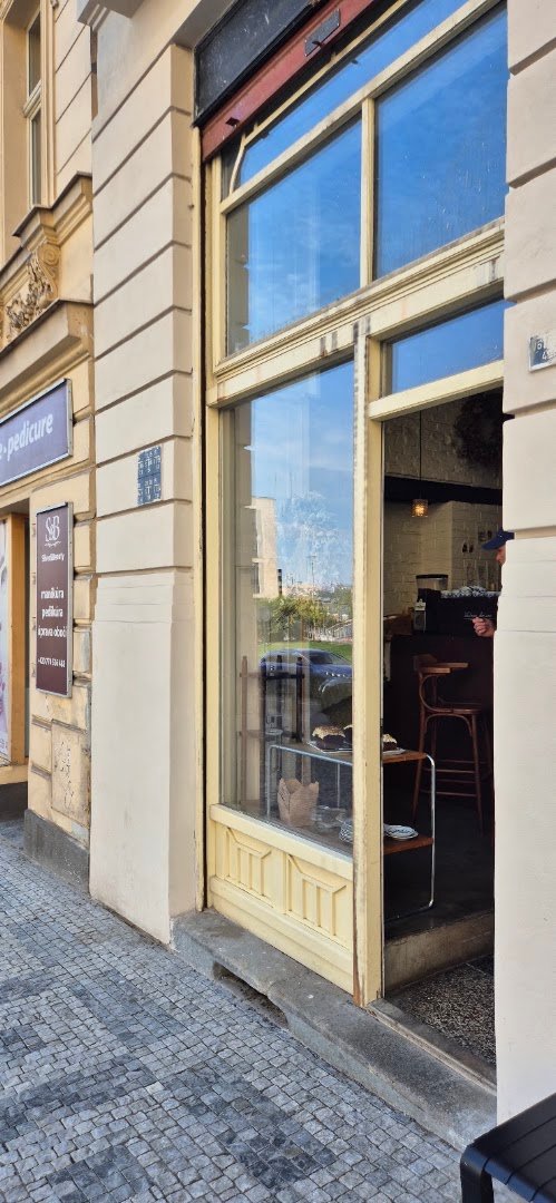 Storefront of Cafe Hrnek, specialty coffee shop in Prague