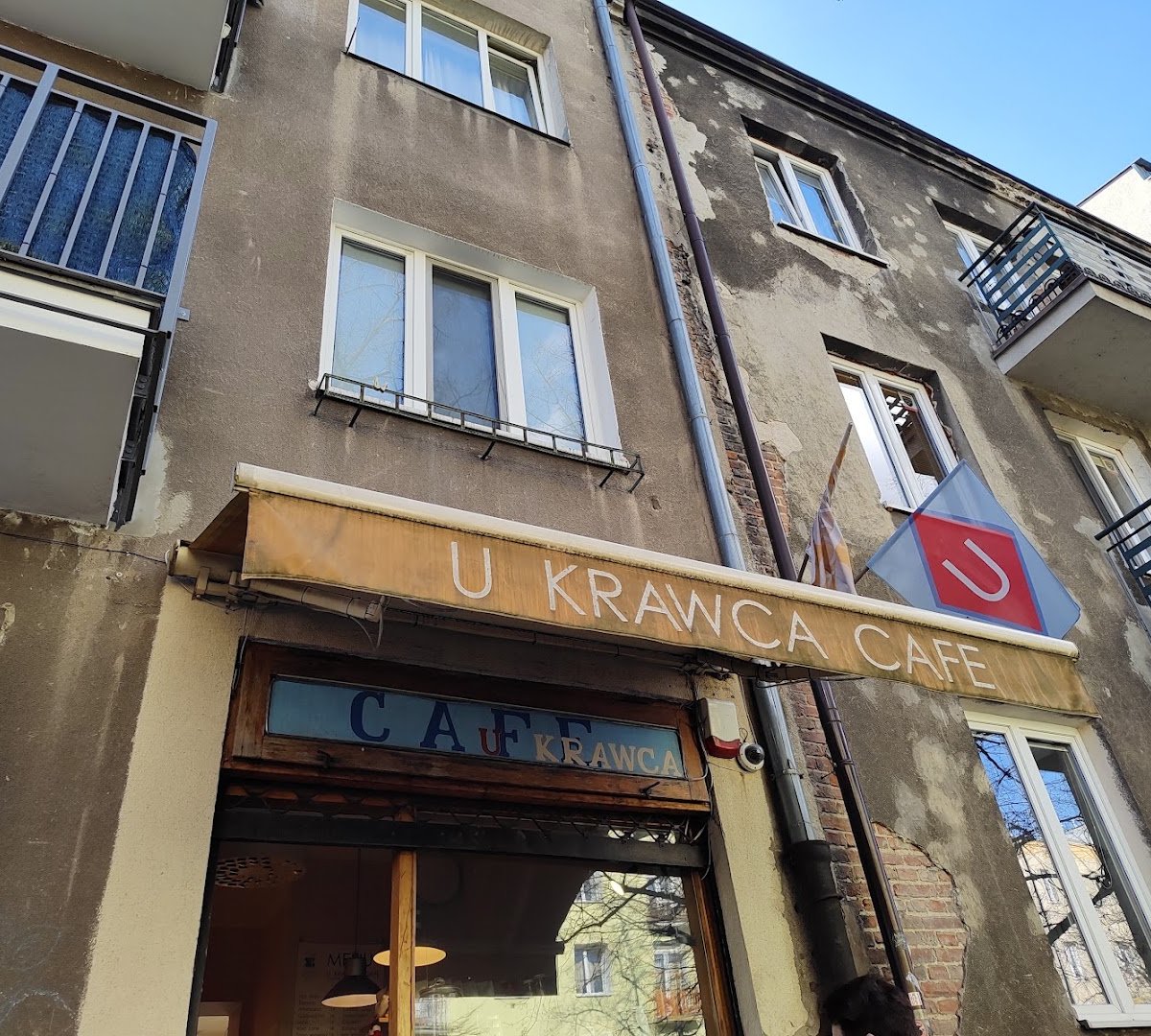 Storefront of U Krawca Café, specialty coffee shop in Warsaw