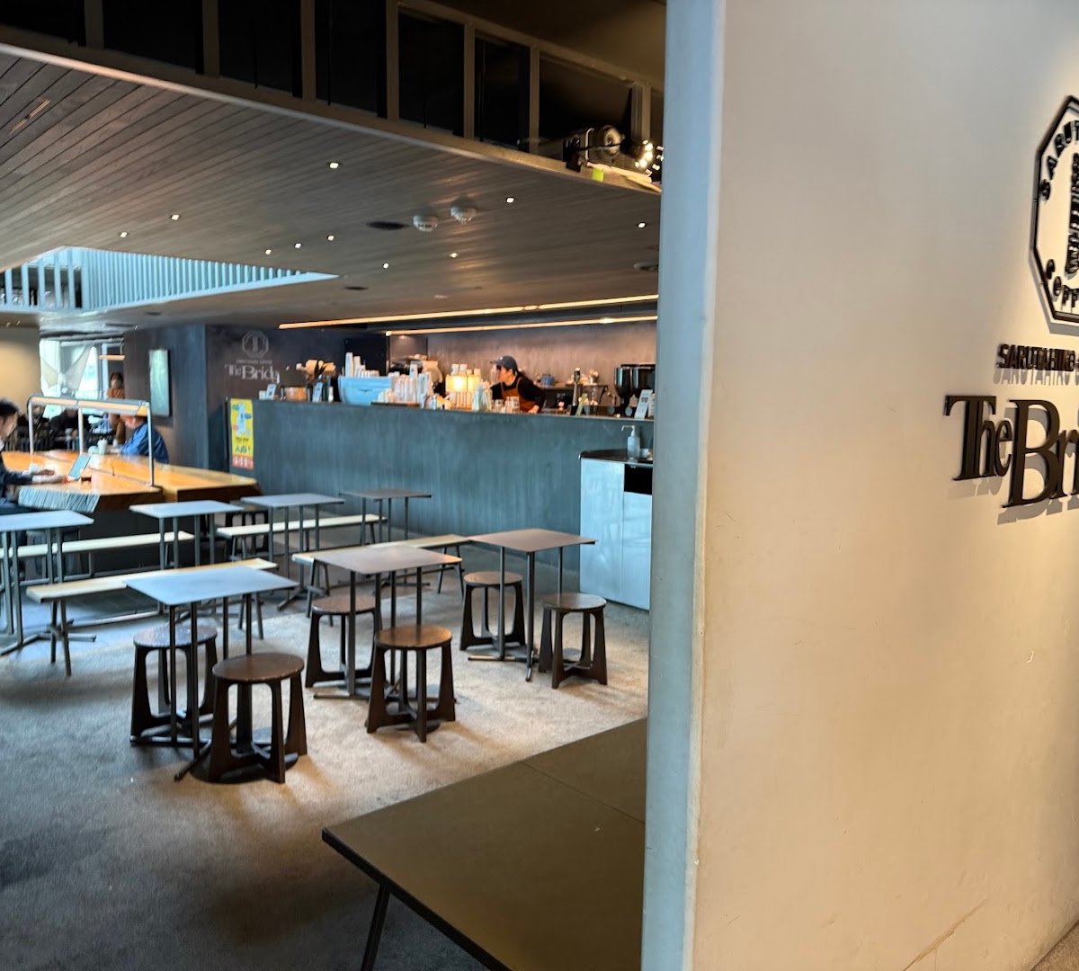 Interior of Sarutahiko Coffee The Bridge, specialty coffee shop in Tokyo