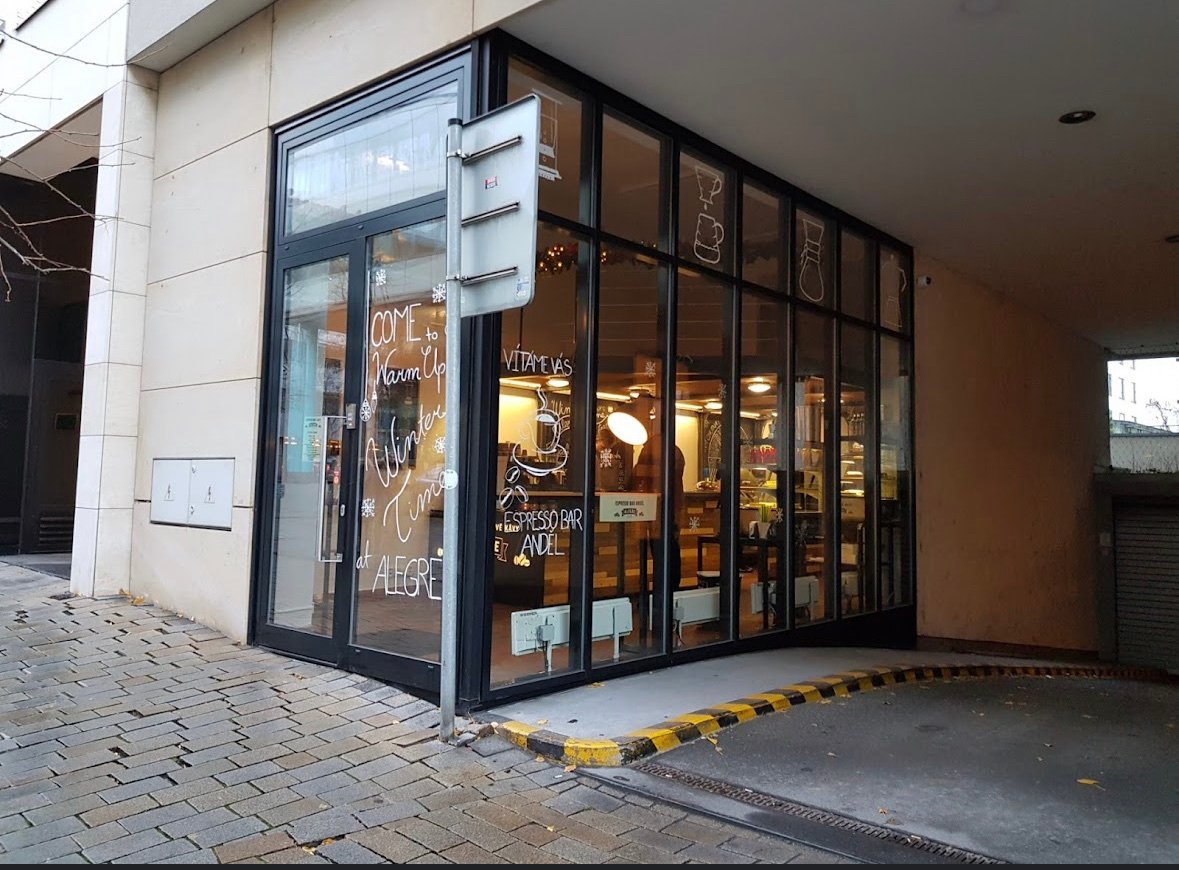 Storefront of Café Alegre, specialty coffee shop in Prague