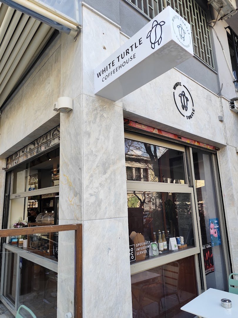 Storefront of White Turtle Coffeehouse, specialty coffee shop in Athens