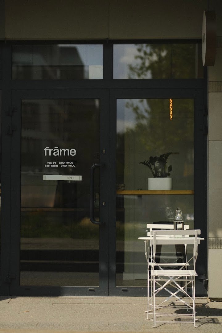 Storefront of The frame coffee, specialty coffee shop in Warsaw