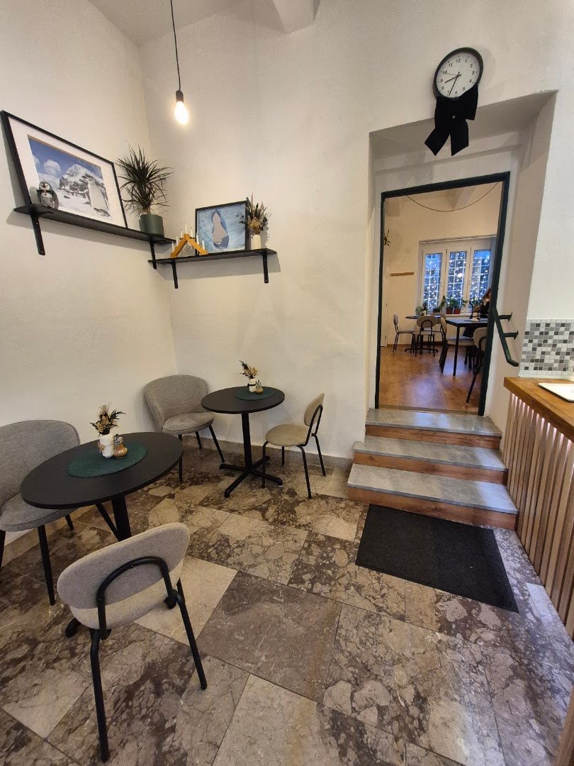 Interior of Penguin Coffee Strašnice, specialty coffee shop in Prague