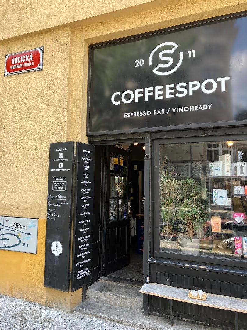 Storefront of Mugshot Coffee, specialty coffee shop in Prague