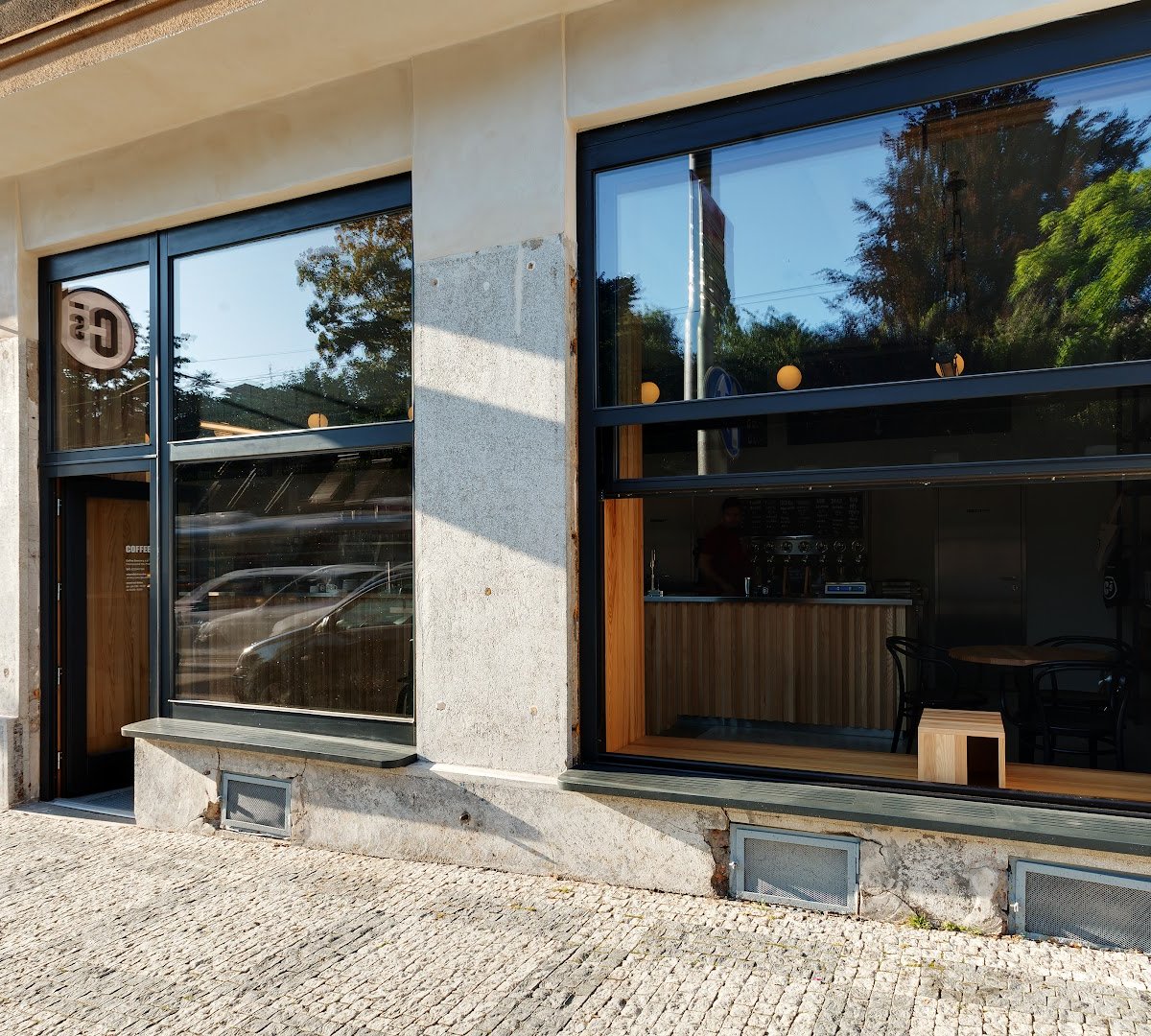 Storefront of Coffee Source Francouzská, specialty coffee shop in Prague