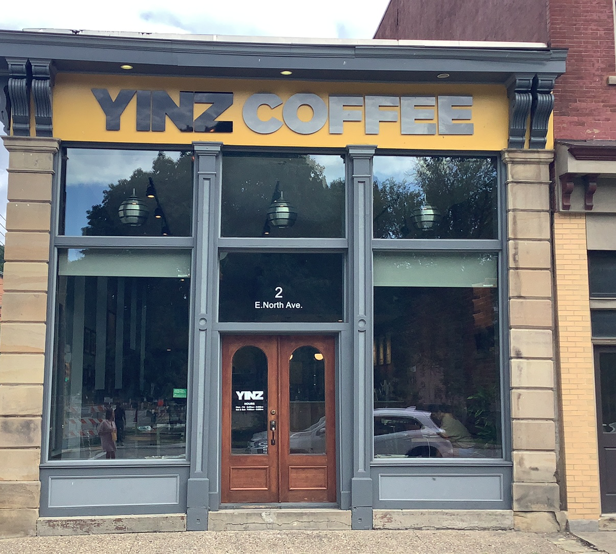 Storefront of Yinz Coffee, specialty coffee shop in Pittsburgh