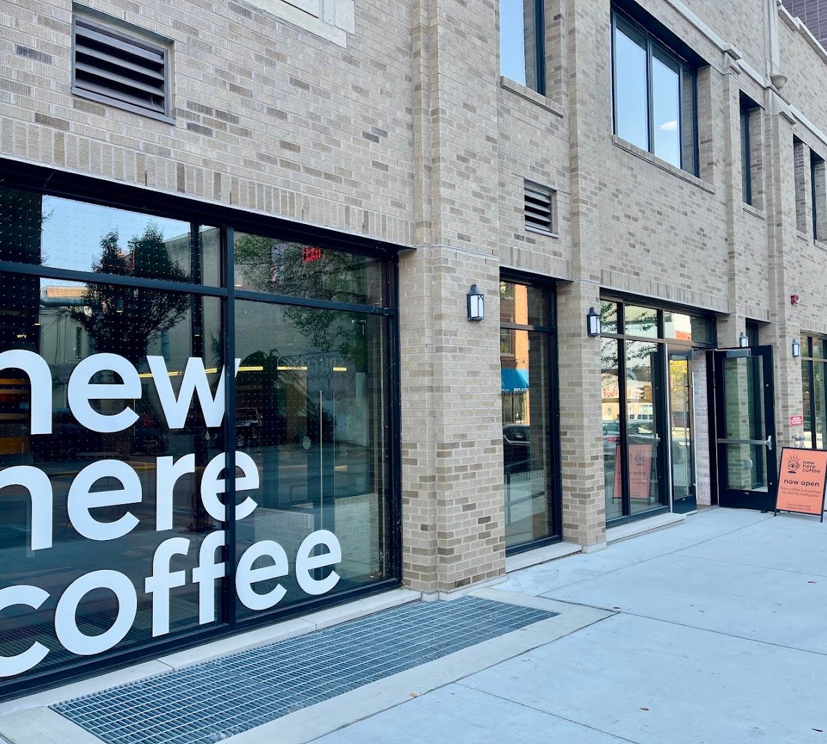 Storefront of New Here Coffee, specialty coffee shop in Madison