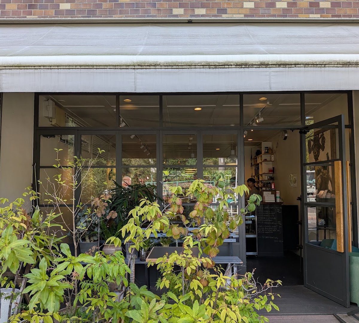 Storefront of TOKAKU Coffee +, specialty coffee shop in Tokyo