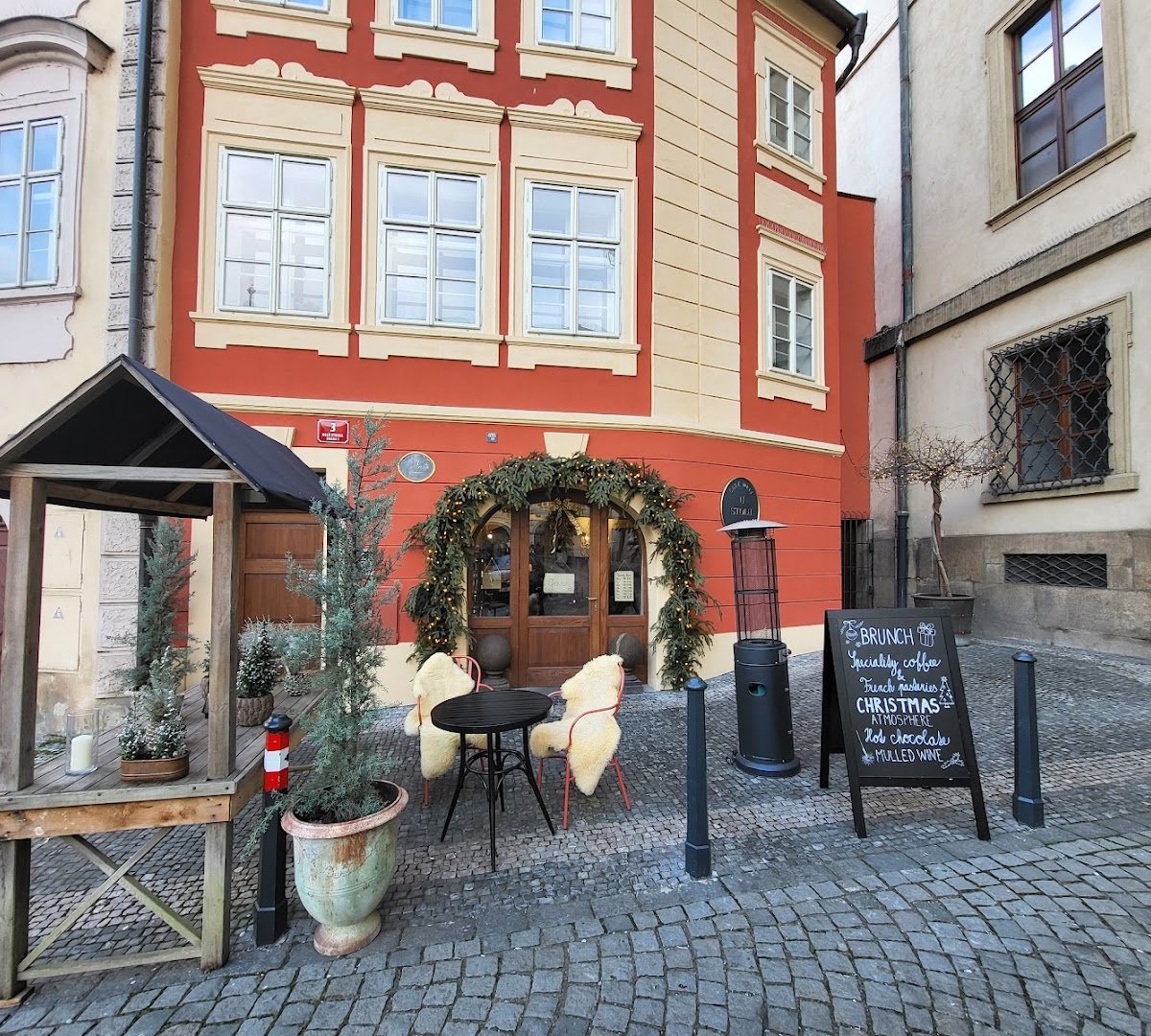 Storefront of U Stolu, specialty coffee shop in Prague