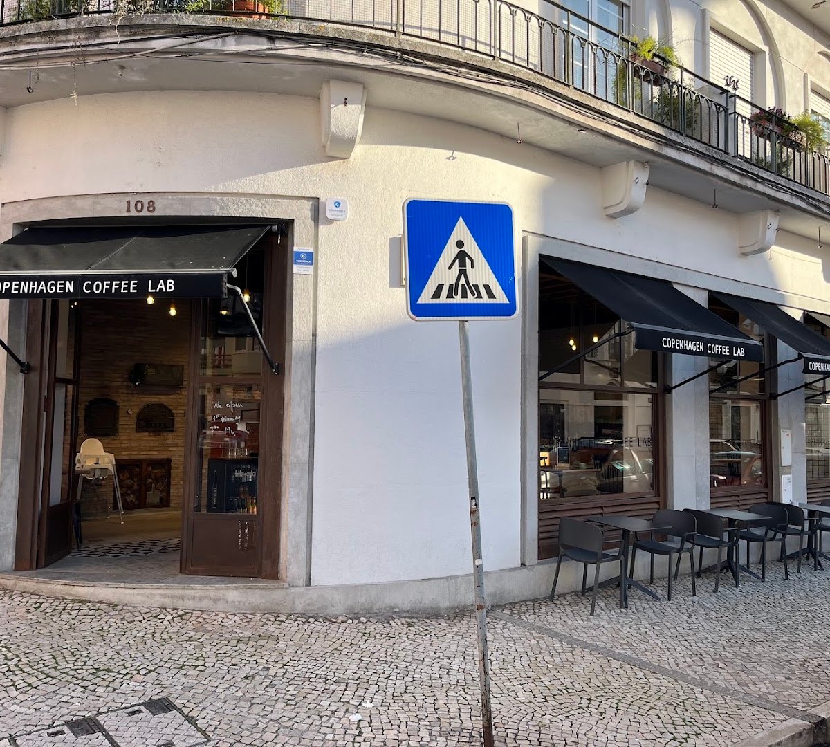 Storefront of Copenhagen Coffee Lab - Campo de Ourique, specialty coffee shop in Lisbon