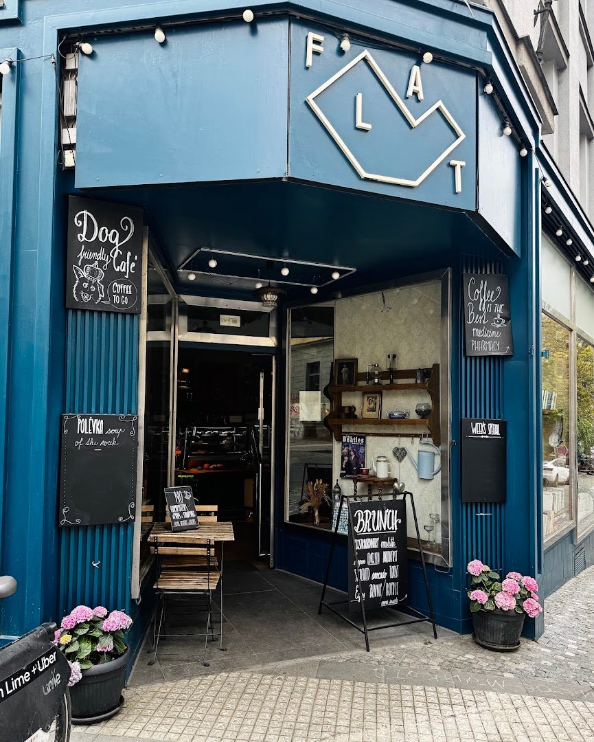Storefront of The FLAT cafe, specialty coffee shop in Prague