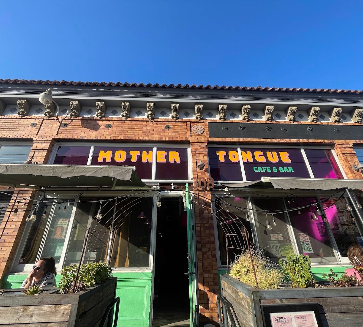 Storefront of Mother Tongue Cafe & Bar, specialty coffee shop in Oakland