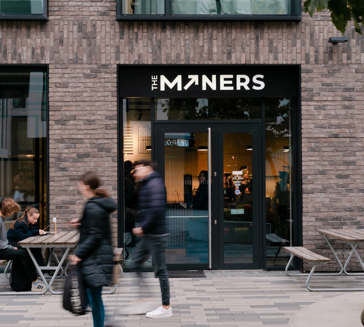 Storefront of The Miners Coffee Churchill, specialty coffee shop in Prague
