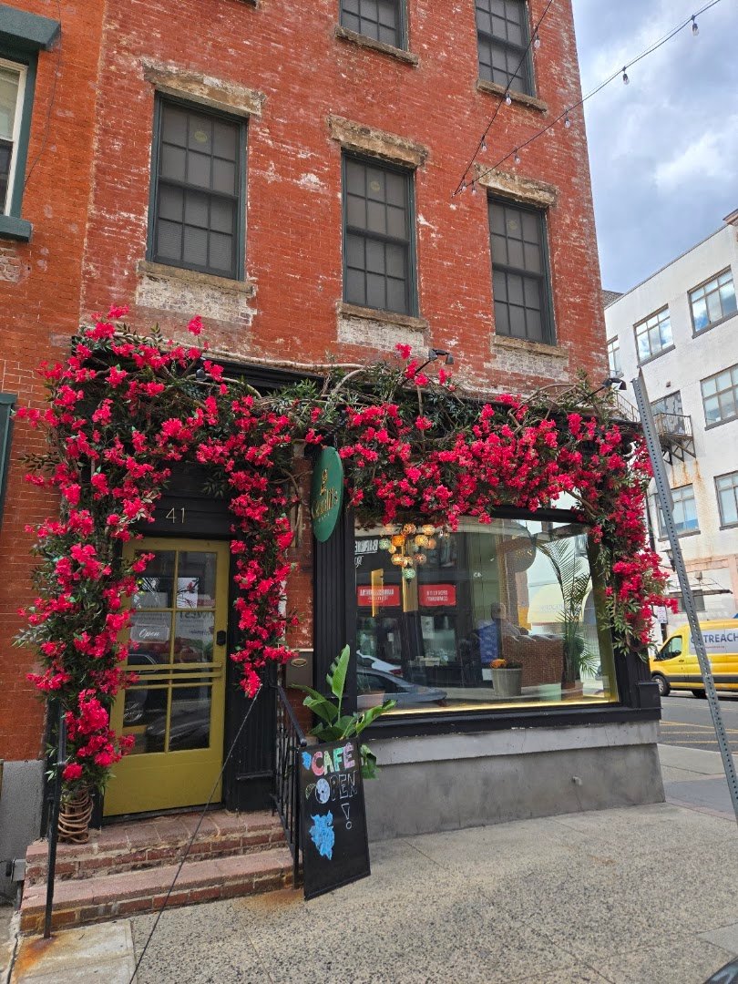 Storefront of Qaalii's Cafe, specialty coffee shop in Newark
