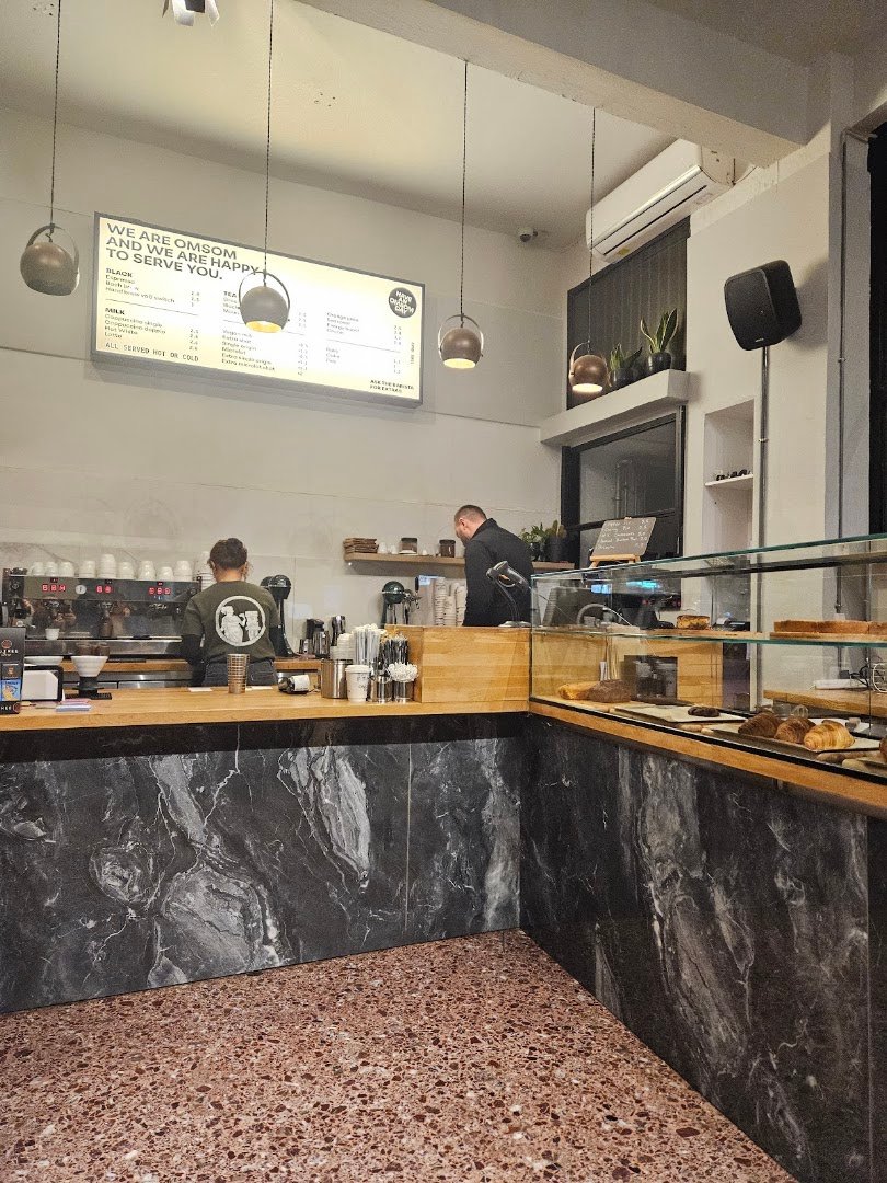 Interior of Omsom Coffee Roasters, specialty coffee shop in Athens