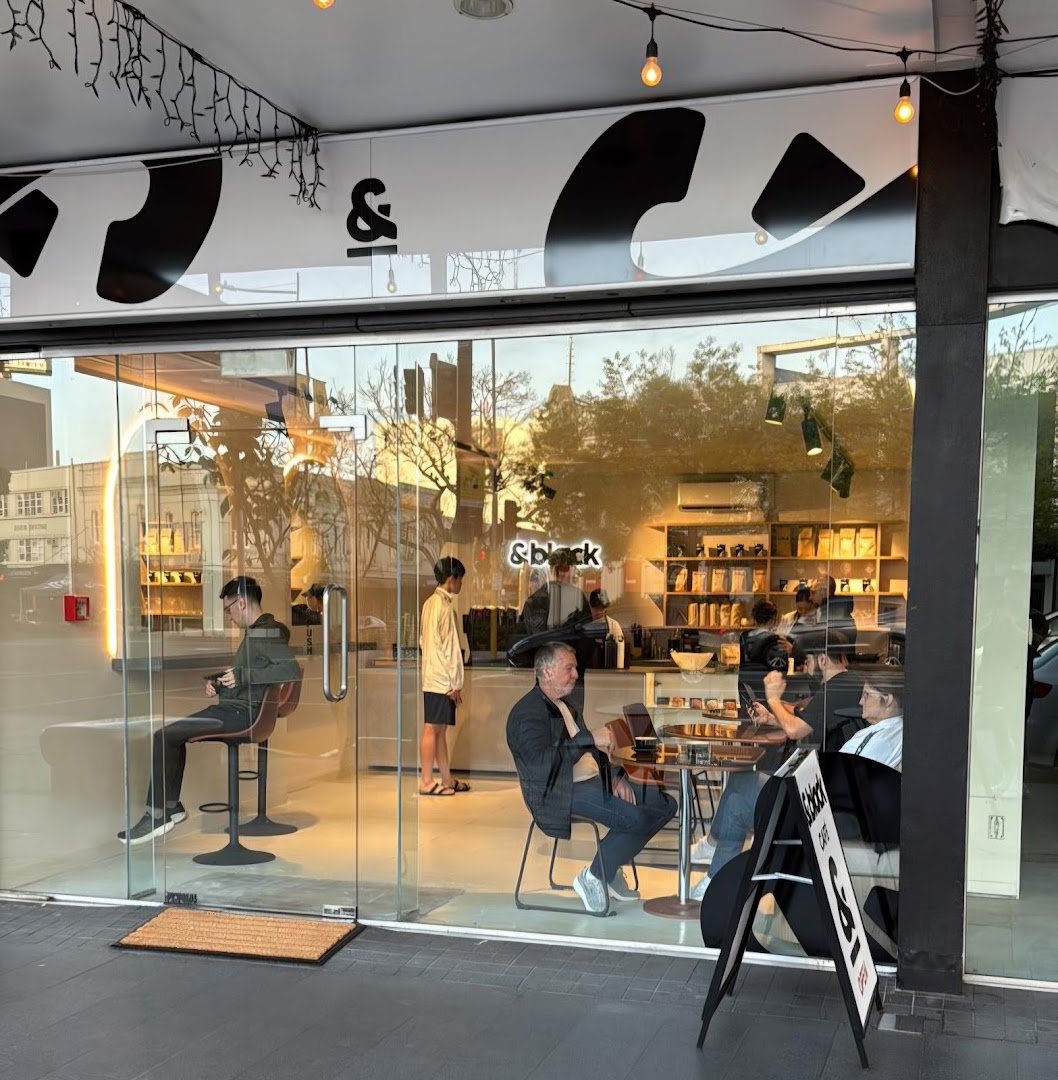 Storefront of &black, specialty coffee shop in Auckland