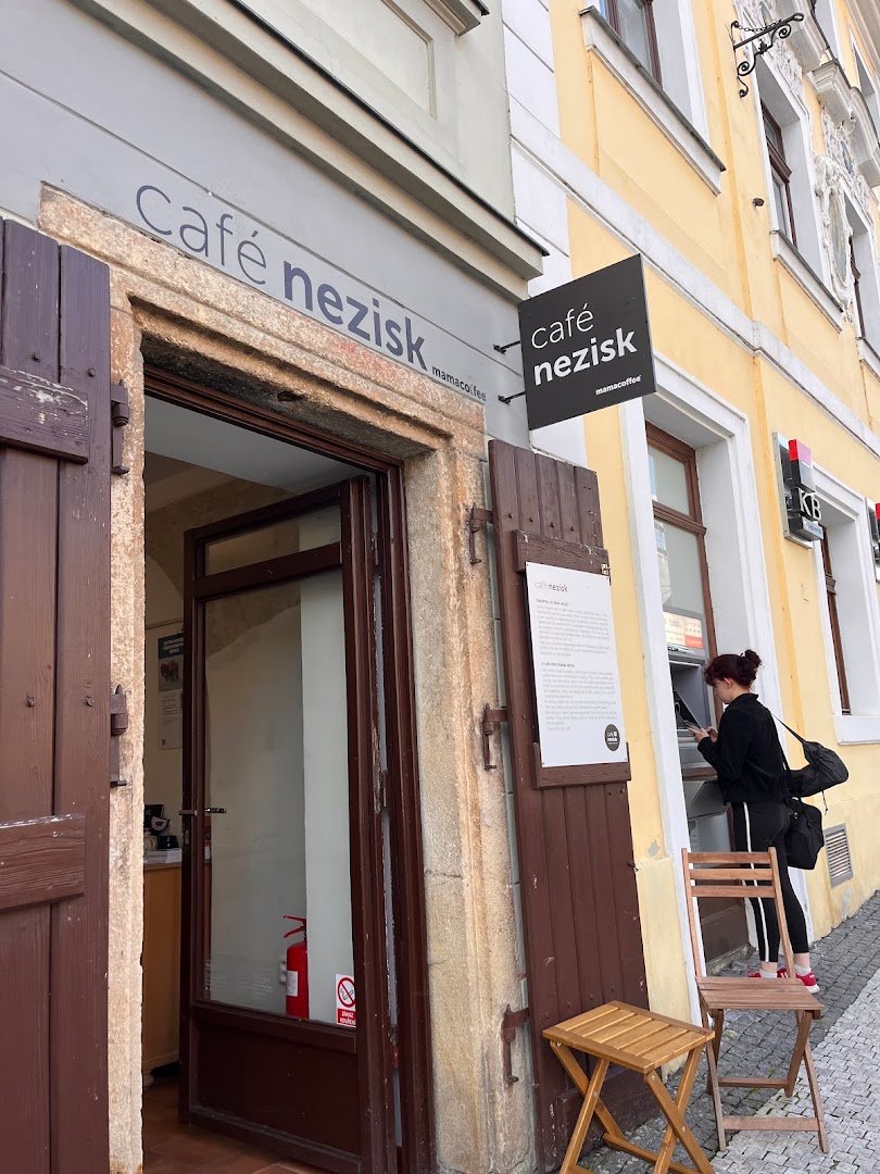 Storefront of Café Nezisk, specialty coffee shop in Prague