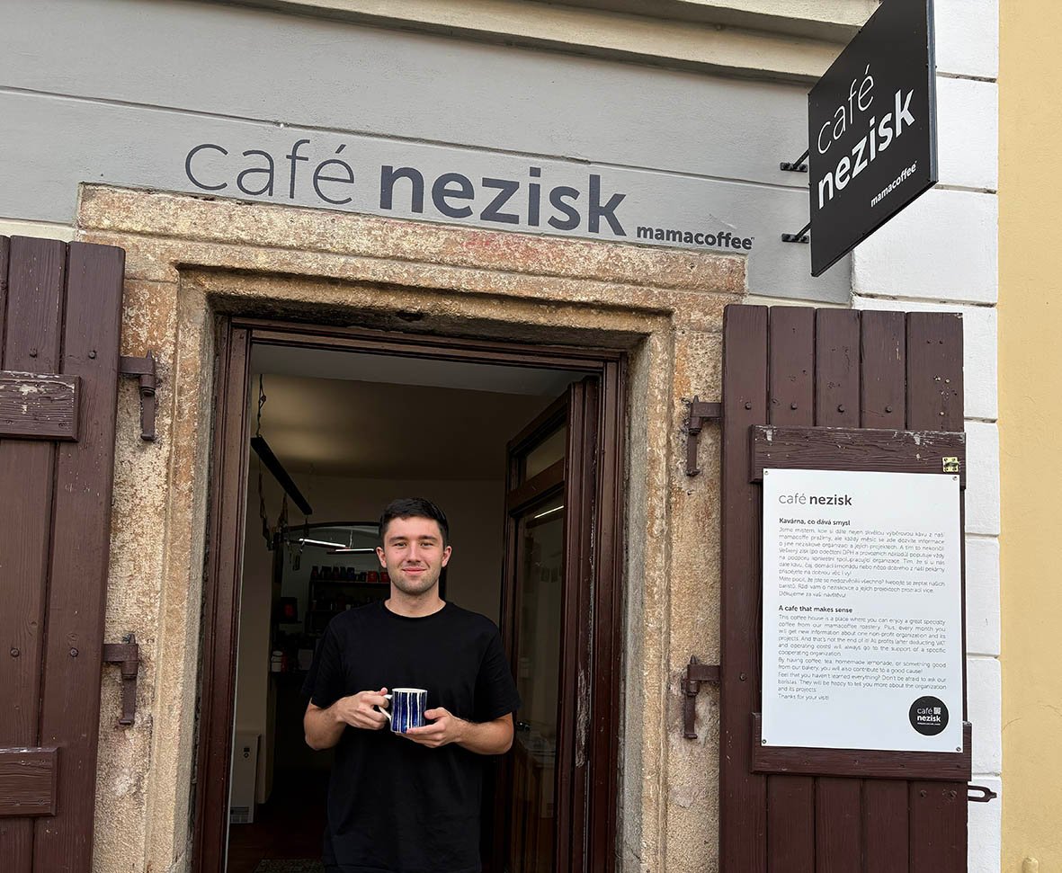 Storefront of Café Nezisk, specialty coffee shop in Prague