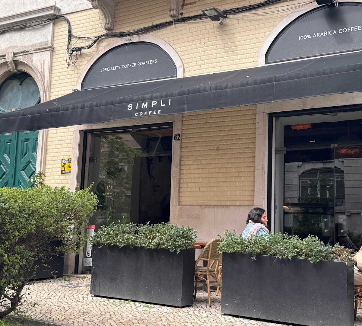 Storefront of Simpli Coffee Braamcamp, specialty coffee shop in Lisbon