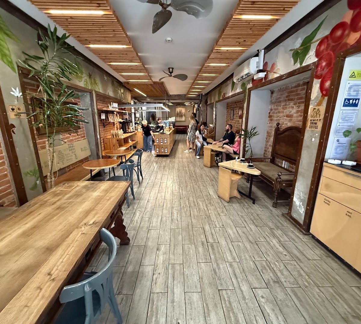 Interior of Fábrica Coffee Roasters, specialty coffee shop in Lisbon