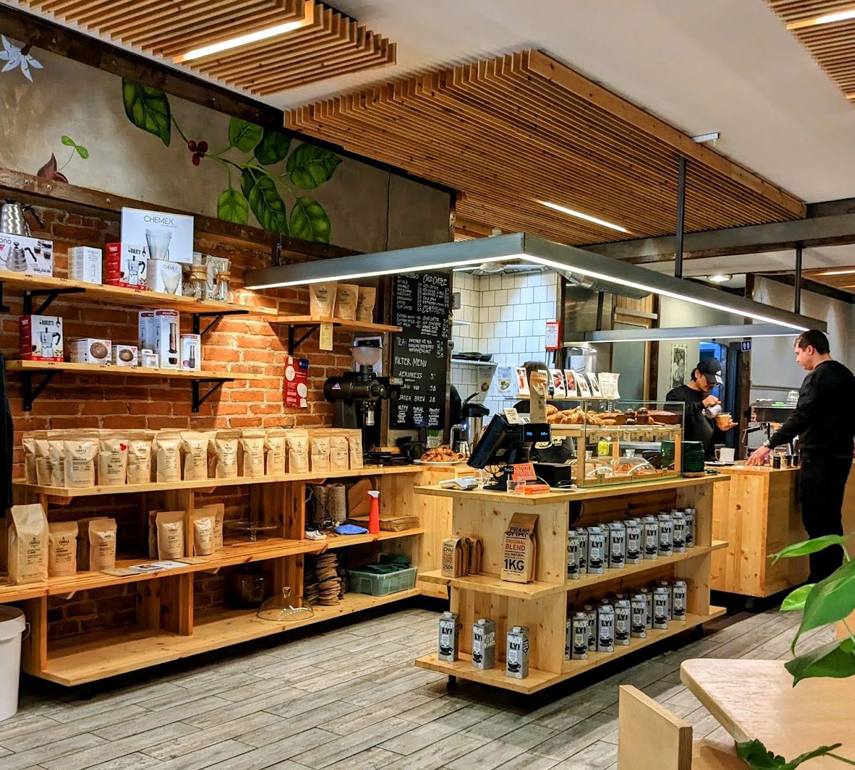 Interior of Fábrica Coffee Roasters, specialty coffee shop in Lisbon