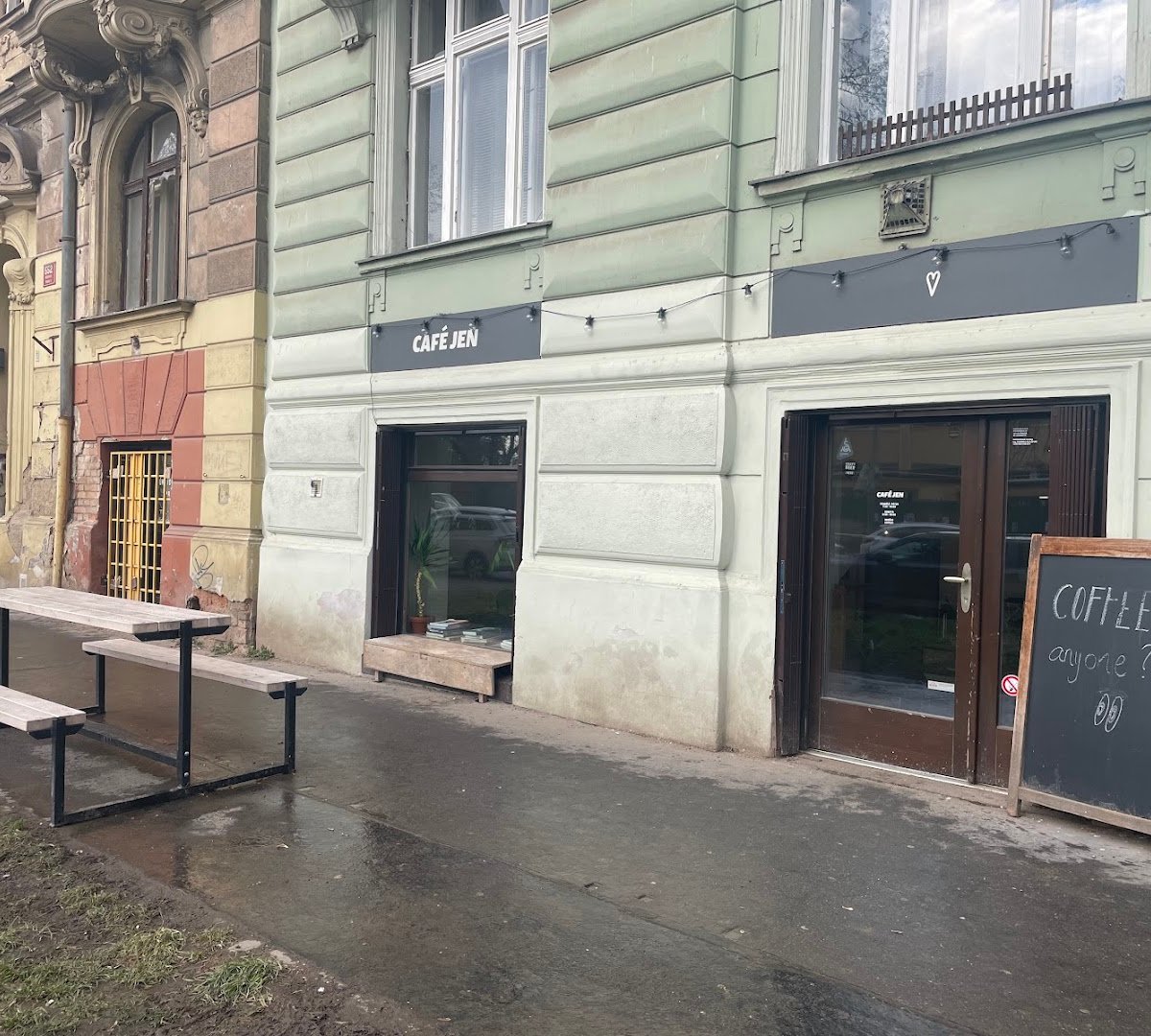 Storefront of Café Jen, specialty coffee shop in Prague