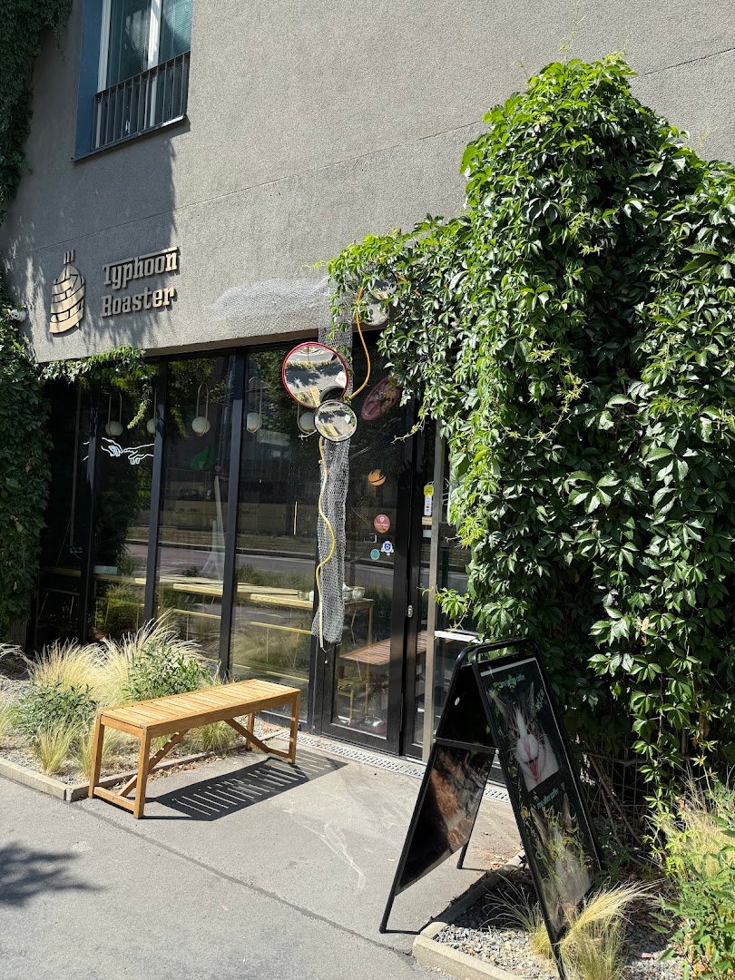 Storefront of Typhoon Coffee, specialty coffee shop in Prague