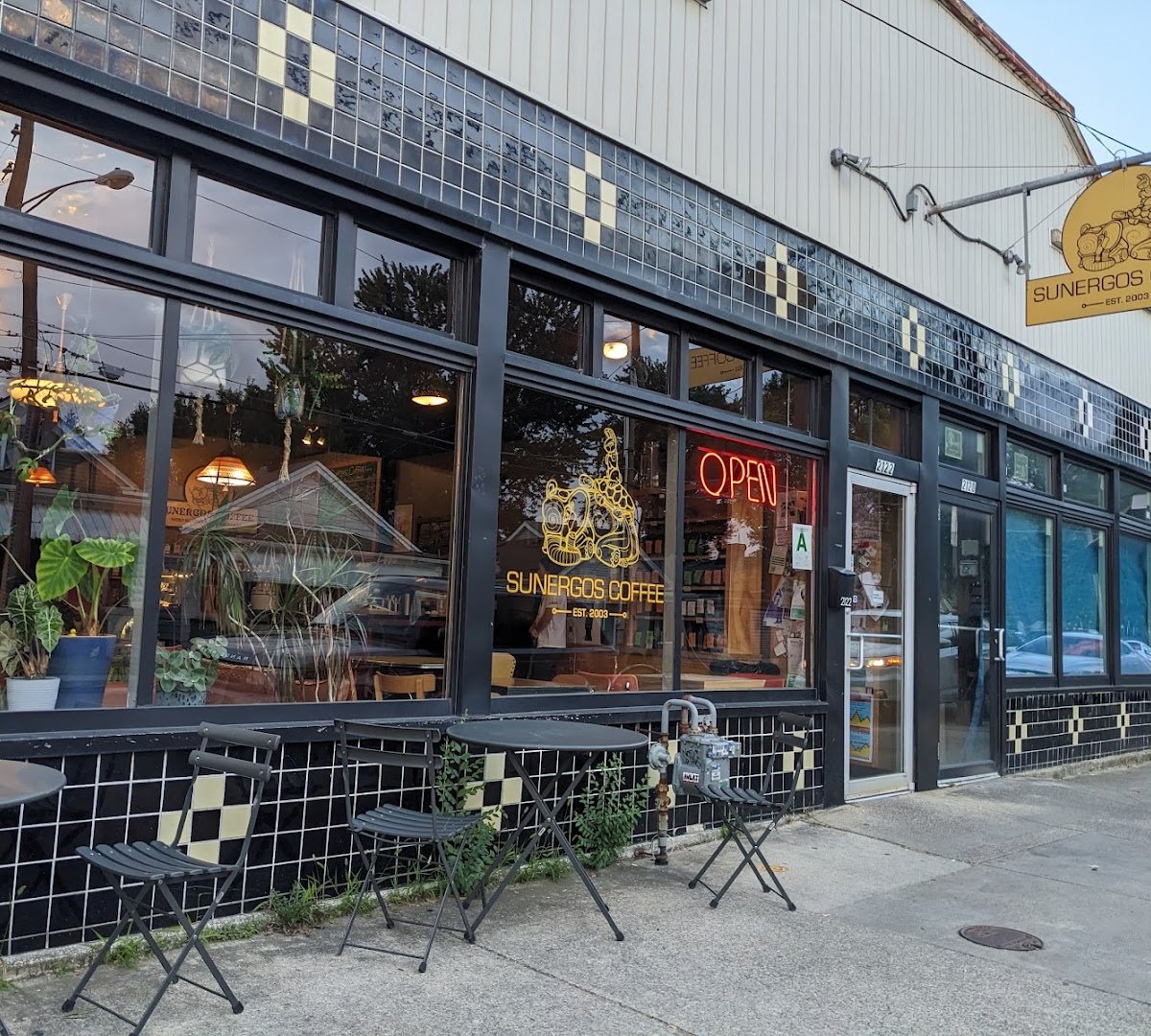 Storefront of Sunergos Coffee, specialty coffee shop in Louisville