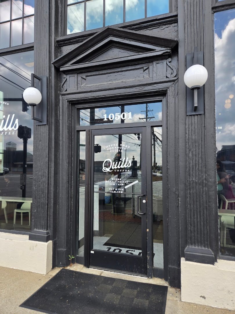 Storefront of Quills Coffee, specialty coffee shop in Louisville