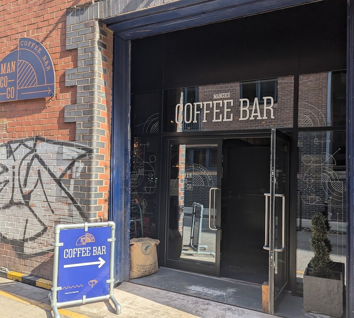 Storefront of Mancoco Coffee Bar, Roastery & Barista Training School, specialty coffee shop in Manchester