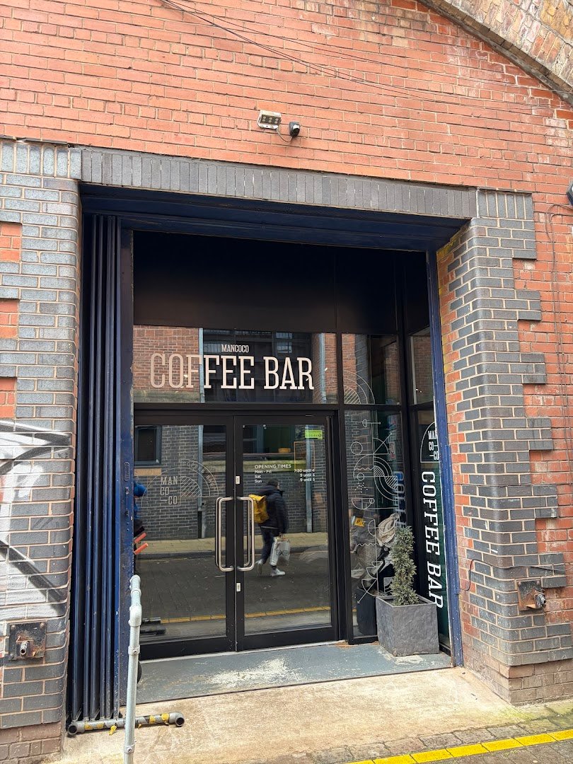 Storefront of Mancoco Coffee Bar, Roastery & Barista Training School, specialty coffee shop in Manchester