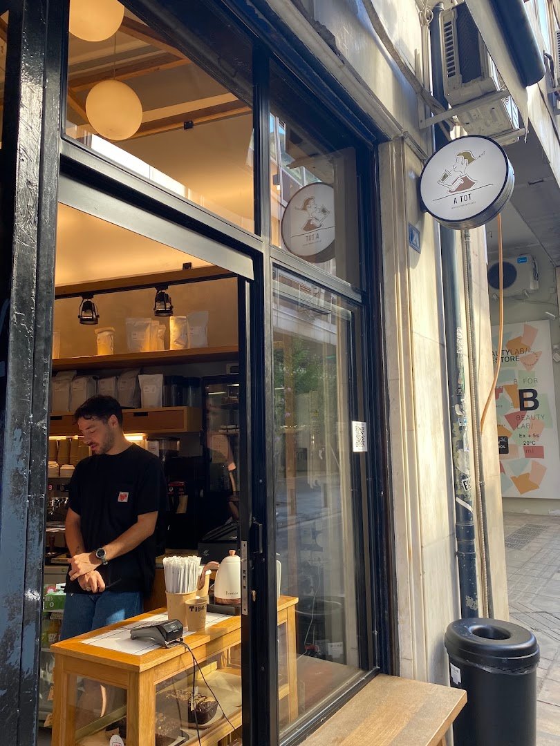 Storefront of A tot, specialty coffee shop in Athens