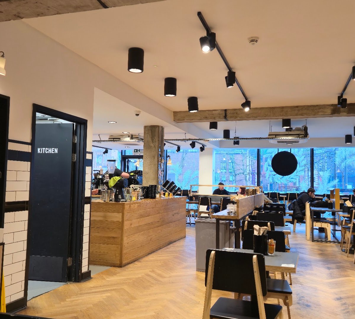 Interior of Bold Street Coffee University Green, specialty coffee shop in Manchester