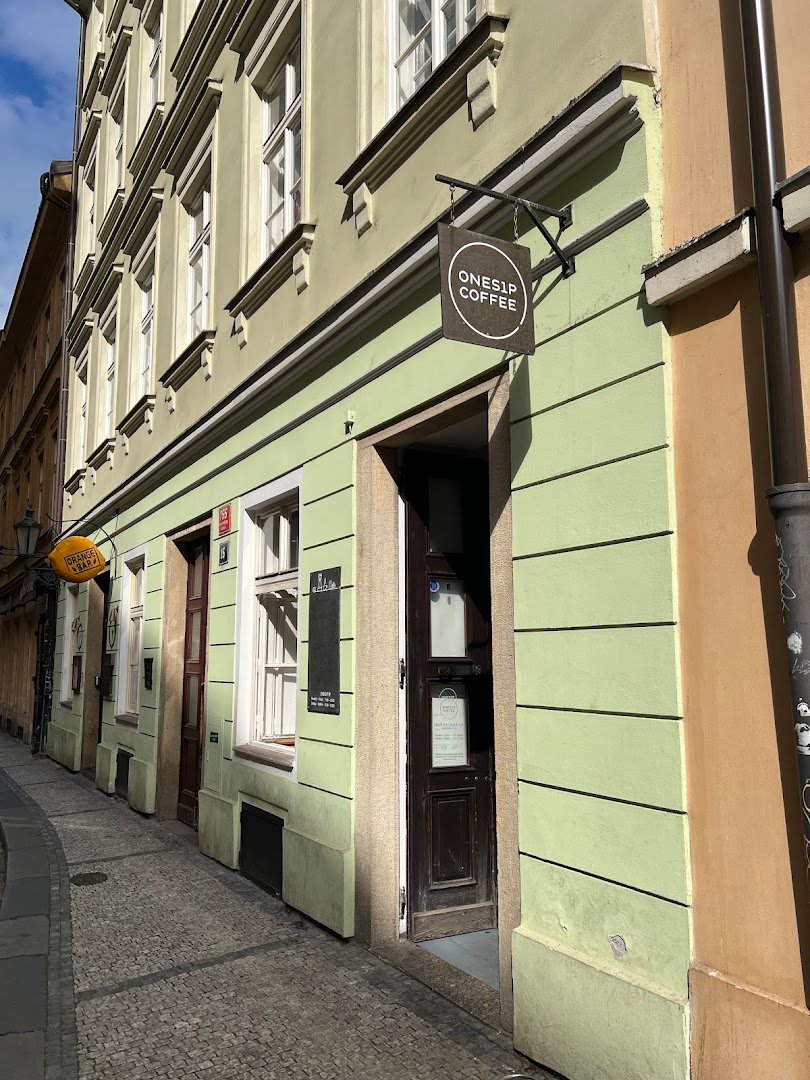 Storefront of onesip coffee, specialty coffee shop in Prague